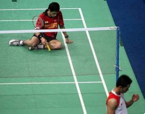 Down and out: Indonesia's Taufik Hidayat (right) celebrates after beating India's Kashyap Parupalli 21-12, 10-21, 21-17 in the first singles yesterday. Indonesia won 3-0 to reach the semi-finals.