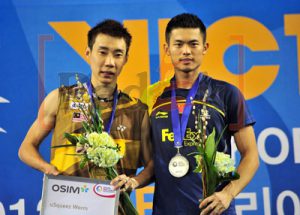 Malaysia's Lee Chong Wei (L) and China's Lin Dan pose on the podium during an awards ceremony after the man's single final match at the Korea Open Super Series Premier in Seoul.