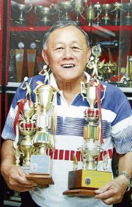 The late Datuk Eddy Choong with some of the many trophies he had won in a stellar career.