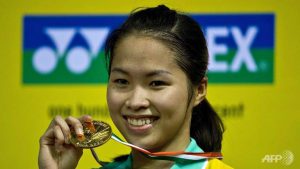 Thailand's Ratchanok Intanon displays her winning medal after beating Juliane Schenk of Germany in the women's singles final of the India Open on April 28, 2013