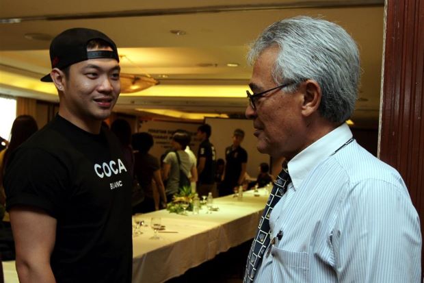 The Badminton Association of Malaysia president Tengku Tan Sri Mahaleel Tengku Ariff having a word with doubles shuttler Koo Kien Keat.