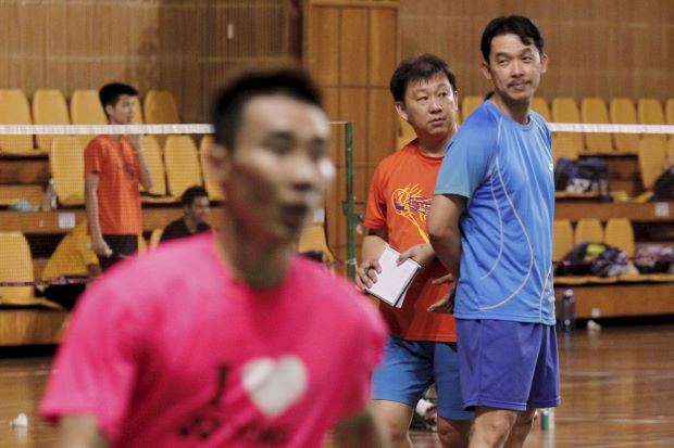 Coaches Rashid Sidek (right) and Tey Seu Bock keeping an eye on Lee Chong Wei and other players at the Juara Stadium.