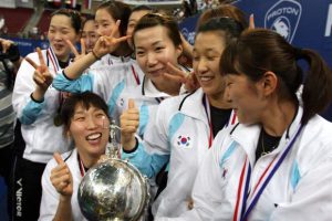 The Korean women's badminton team celebrating with the Uber Cup trophy after shocking China in the final in KL in 2010.