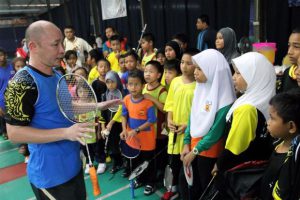 Former national chief coach and player Yap Kim Hock, seen here with kids from Pandamaran at his badminton academy, has applied for the men's doubles coaching position with BAM on Friday.
