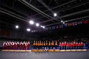 England, Malaysia, Singapore (from left) stand on podium for national anthem of Malaysia - "Negaraku"