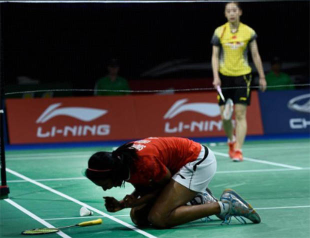 P.V. Sindhu celebrates after her victory against Wang Shixian