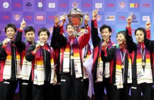 Japan head coach Park Joo-bong holds aloft the Thomas Cup after they beat Malaysia 3-2 in the Thomas Cup final in New Delhi last May.