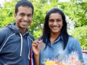 P Gopichand (L) with P.V. Sindhu after she returned home with a bronze medal at badminton World Championships in Copenhagen.
