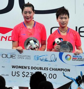 Yu Xiaohan (left) and Ou Dongni win women's doubles title of the OUE Singapore Open on April 12, 2015.