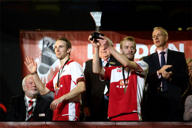 Mathian Boe (L) and Carsten Mogensen (R) of Denmark lift the 2013 London Badminton Grand Prix trophy.