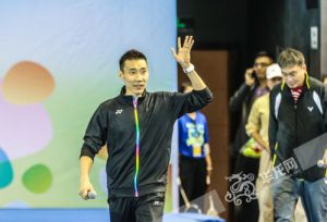 Lee Chong Wei waves to the crowd with Zhao Jianhua walks beside him.