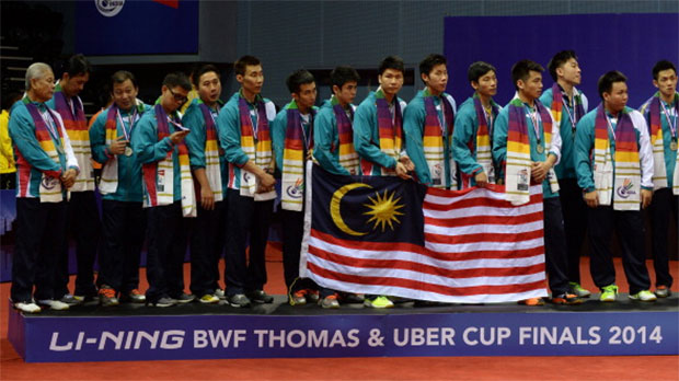 Members of the Malaysia men's badminton team pose on the podium as runners-up following a 2-3 defeat to Japan in the 2014 Thomas Cup final. (photo: GettyImages)