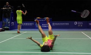 Chen Qingchen (R) and Tang Yuanting of China celebrate their victory after clinching the winning point against Korea in the Uber Cup final. (photo: AFP)