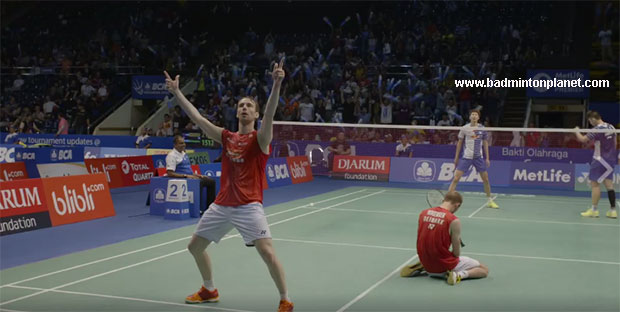 Carsten Mogensen drops to his knees while Mathias Boe celebrates their 1st round victory at the 2016 Indonesia Open.