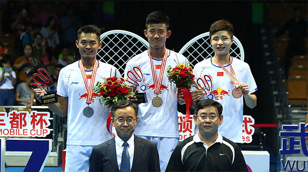 Chen Long (middle) wins his first Badminton Asia Championships in Wuhan on Sunday.