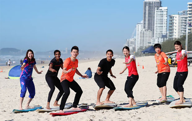 Sung Ji Hyun of Korea (from left), PV Sindhu of India, Zheng Siwei of China, Jonatan Christie of Indonesia, Misaki Matsutomo of Japan, Chen Qingchen of China and Ayaka Takahashi at Surfers Paradise Beach. (photo: Chris Hyde)
