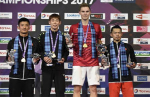 Viktor Axelsen poses with Lin Dan (right), Chen Long (far left), and Son Wan-Ho on the podium after winning the 2017 men's singles World Champion. (photo: AP)