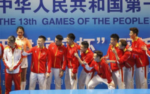 Lin Dan and the Beijing team pose with the China National Games trophy following their victory against Fujian in the final. (photo: AP)
