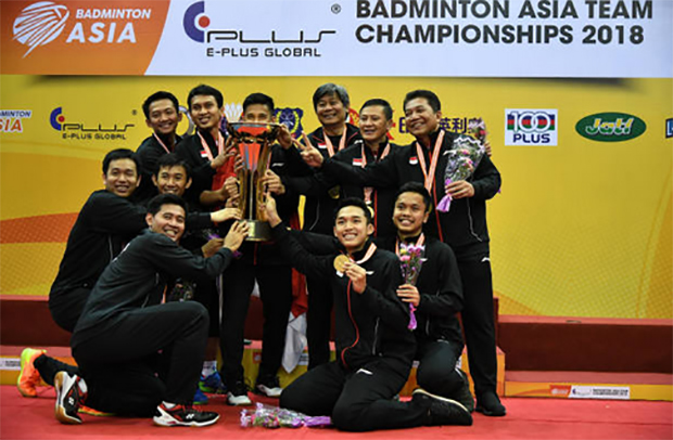 Indonesia team celebrates on the podium with the 2018 Badminton Asia Team Championships trophy. (photo: AP)