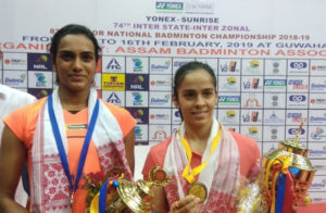 Saina Nehwal defeats PV Sindhu (L) to retain the 2019 India National Badminton Championship title. (photo: BAI Media)