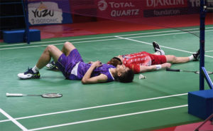 Both Chou Tien Chen (L) and Anders Antonsen lying on the court after an incredible match. (photo: Xinhua/Zulkarnain)