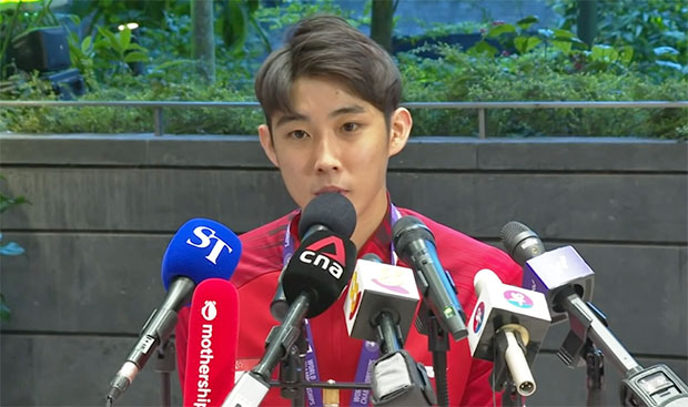 Loh Kean Yew speaks to Singaporean media at Changi Airport. (source: Screenshot ST YouTube)