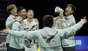 The Taiwanese players rush to the badminton court to celebrate after defeating Denmark 3-1 in the 2024 Thomas Cup quarterfinals. (Photo: Shi Tang/Getty Images)