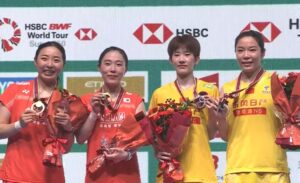 Kong Hee Yong, Kim Hye Jeong, Zhang Shu Xian and Jia Yi Fan (from left) pose for photos during the Japan Open women’s doubles awards ceremony. (Photo: BWF)
